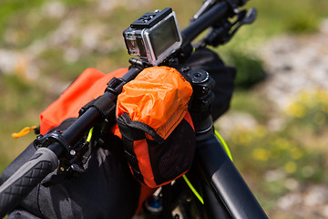 Image showing Bicycle with orange bags for travel