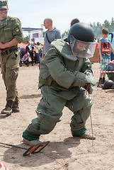 Image showing Visitors of show try on the sapper suit