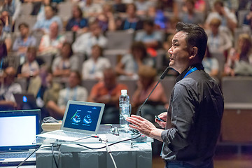 Image showing Public speaker giving talk at Business Event.