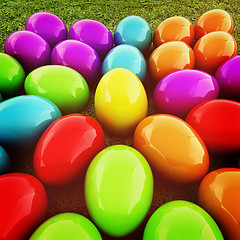 Image showing Colored Easter eggs as a flower on a green grass. 3D illustratio