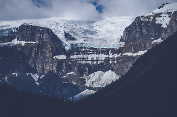 Image showing Mountains with snow in cloudy weather