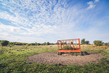 Image showing Rural field with a red cage