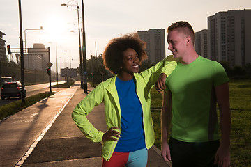 Image showing Portrait of romantic pretty couple on fitness session, outside t