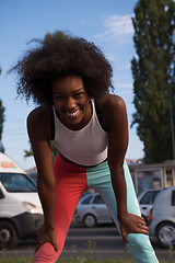 Image showing Portrait of sporty young african american woman running outdoors