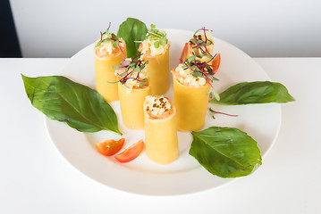 Image showing appetizer - cheese rolls with meat and vegetables