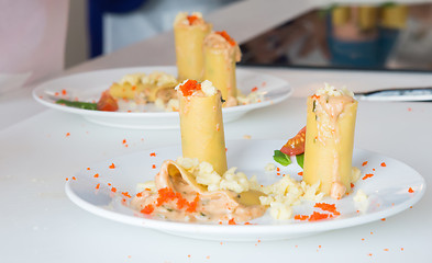 Image showing appetizer - cheese rolls with meat and vegetables