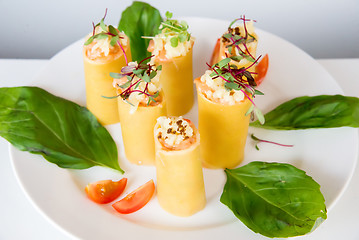 Image showing appetizer - cheese rolls with meat and vegetables