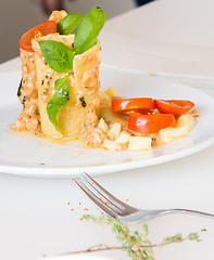 Image showing appetizer - cheese rolls with meat and vegetables