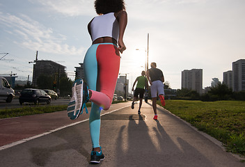 Image showing multiethnic group of people on the jogging