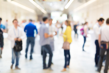 Image showing Abstract blurred people socializing during coffee break at business conference.