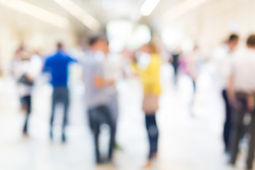 Image showing Abstract blurred people socializing during coffee break at business conference.