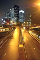 Image showing urban landscape at night and through the city traffic 