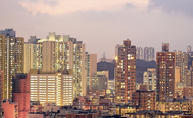 Image showing urban city at sunset with all lights lit up 