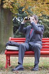 Image showing Businessman searching with binoculars