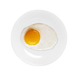 Image showing Top view of white dish with fried egg