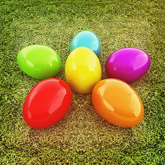 Image showing Colored Easter eggs as a flower on a green grass. 3D illustratio