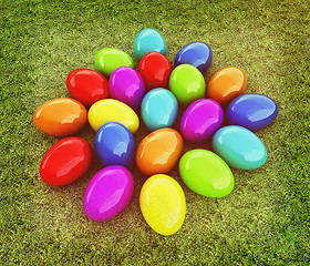 Image showing Colored Easter eggs on a green grass. 3D illustration. Vintage s