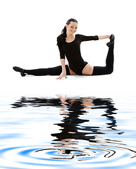 Image showing fitness instructor in black leotard on white sand #2