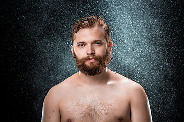 Image showing The water splash on male face