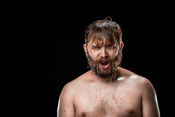 Image showing The water splash on male face