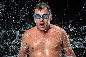 Image showing The water splash on male face