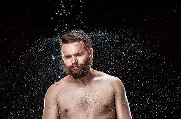 Image showing The water splash on male face