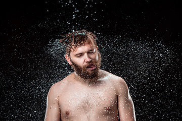 Image showing The water splash on male face