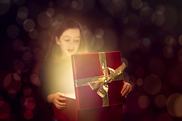 Image showing Little girl opening a magic box