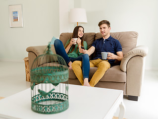 Image showing Watching tv and drinking coffee