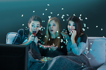 Image showing Scared teenage watching movies 