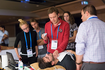 Image showing Participants learning new ultrasound techniques on medical congress.