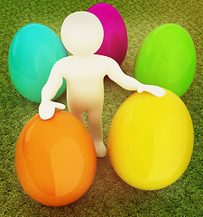 Image showing 3d small person holds the big Easter egg in a hand. 3d image. On