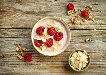 Image showing bowl of yogurt with raspberries and almond