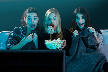 Image showing Scared teenage watching movies 