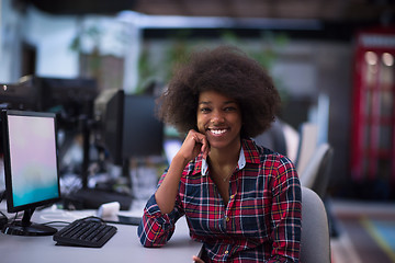 Image showing portrait of a young African American woman in modern office