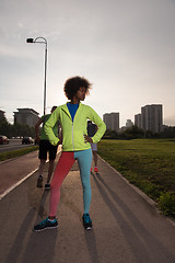 Image showing Portrait of sporty young african american woman running outdoors