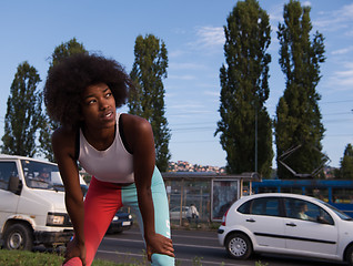 Image showing Portrait of sporty young african american woman running outdoors