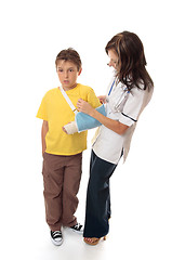 Image showing Nurse assisting an injured boy