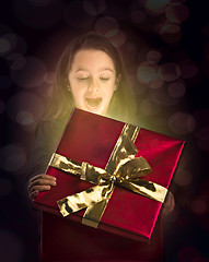 Image showing Little girl opening a magic box