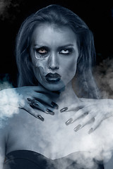Image showing Pretty gothic woman with hands of vampire on her neck