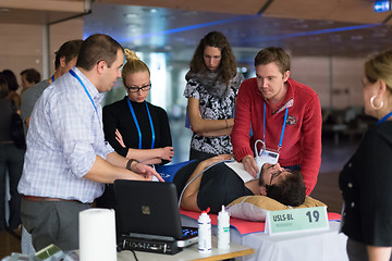 Image showing Participants learning new ultrasound techniques on medical congress.