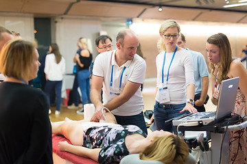 Image showing Participants learning new ultrasound techniques on medical congress.