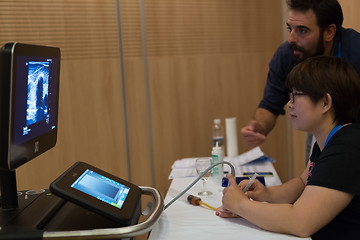 Image showing Participants learning new ultrasound techniques on medical congress.