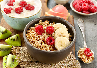 Image showing bowl of granola with fruits and berries for healthy breakfast