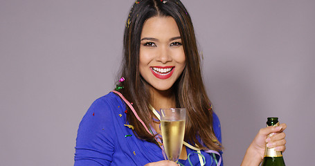 Image showing Gorgeous young woman celebrating with champagne