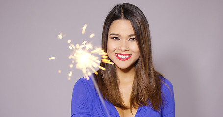 Image showing Happy young woman celebrating at a party