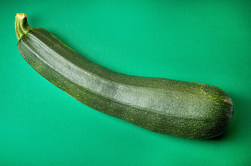 Image showing fresh zucchini on green background