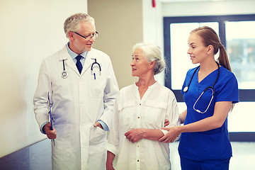 Image showing medics and senior patient woman at hospital