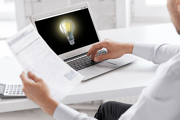 Image showing businessman with laptop computer working at office