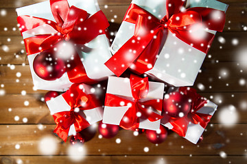 Image showing close up of gift boxes and red christmas balls